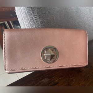 Rose gold Kate Spade clutch with super cute closure!